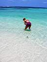 Nancy with a conch shell at Nancy and Walker's secret beach on Anegada