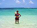 Nancy with a conch shell at Nancy and Walker's secret beach on Anegada