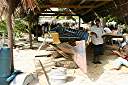 Carib craftsmen from Dominica repairing damage to Gli Gli.