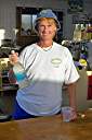 Nancy at work, wearing her Cow Wreck Beach Staff shirt.