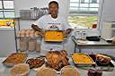 Bell and her traditional Thanksgiving dinner: turkey, ham, stuffing, sweet potatoes, pumpkin pies.