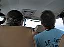 Flying into Anegada on Island Birds. The back of Davide and Walker's heads.