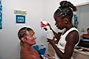 Janesha braiding Nancy's hair.