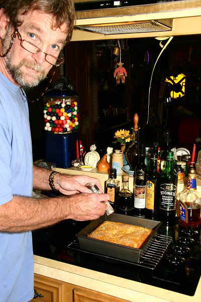 Walker finishing the cake with fresh grated nutmeg