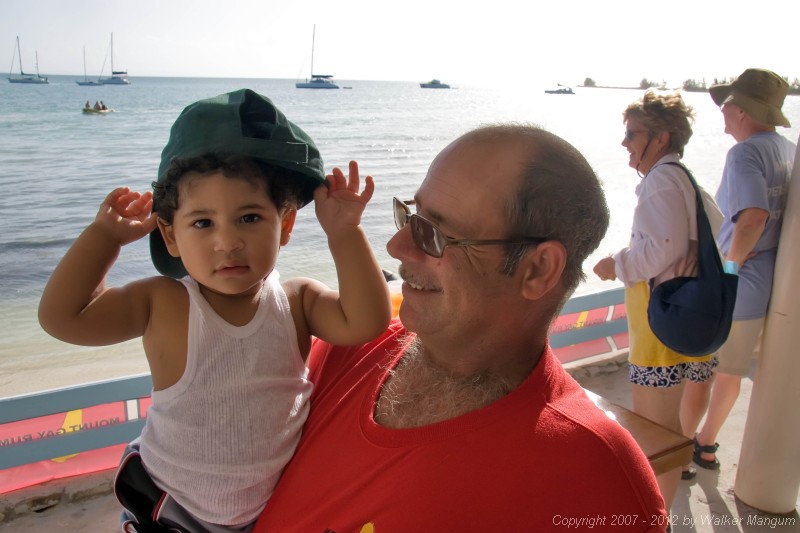 Thomas and Dean Soares watching the Dark and Stormy lay day dinghy races at Neptune's Treasure.