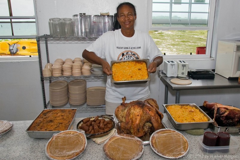 Bell and her traditional Thanksgiving dinner: turkey, ham, stuffing, sweet potatoes, pumpkin pies.