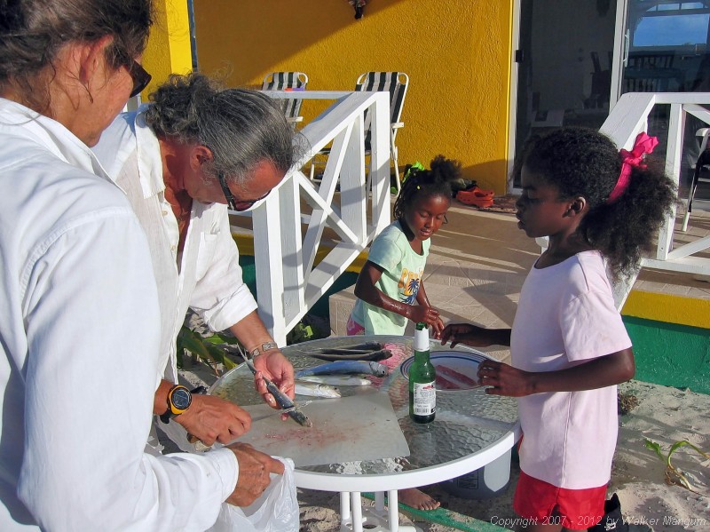 Davide fileting fish for dinner.